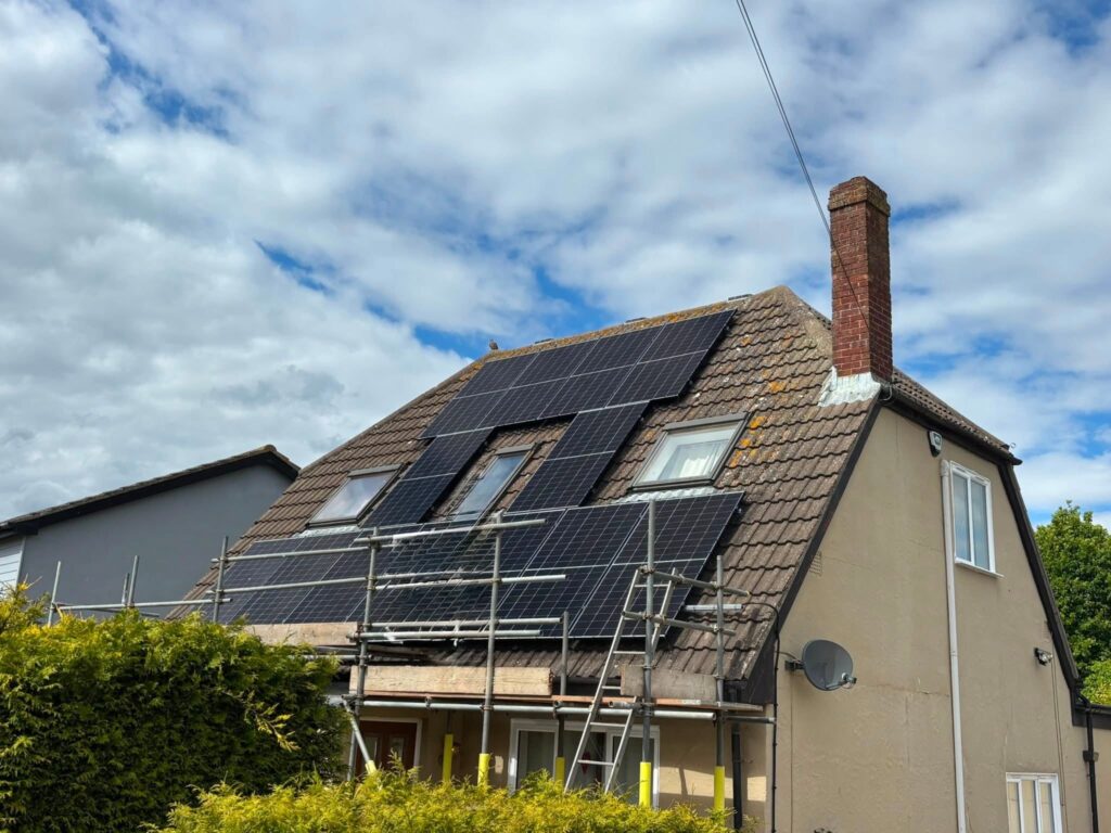 Cost of solar panel installation demonstrated by house having solar installed