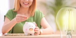 Woman with piggy bank considering how much do solar panels save on electricity bills